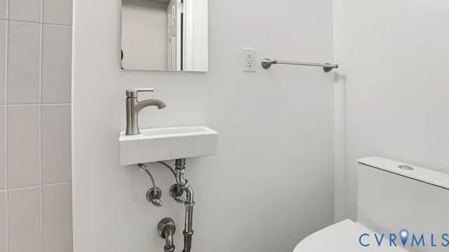 a bathroom with a sink a vanity and shower