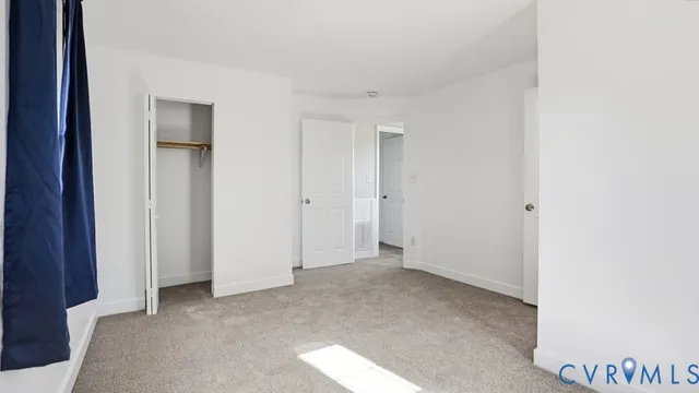 a white bath tub sitting next to a white sink and a shower
