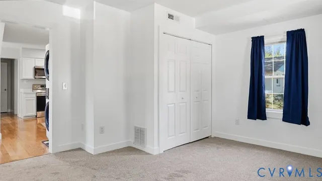 a kitchen with stainless steel appliances kitchen island granite countertop a refrigerator and microwave