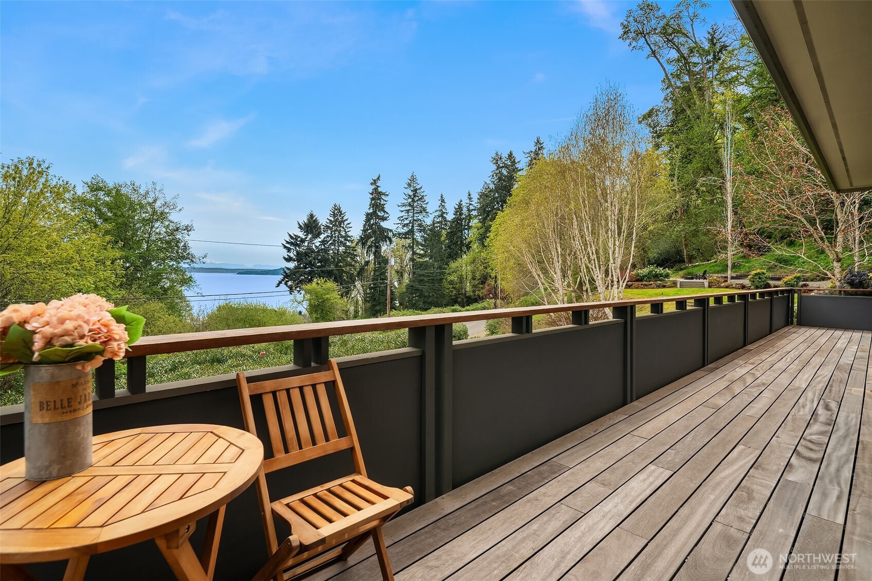 8302 Southwest Dilworth Road Vashon, WA 98070 - Photo 32 of 40 a view of a balcony with wooden floor and outdoor seating