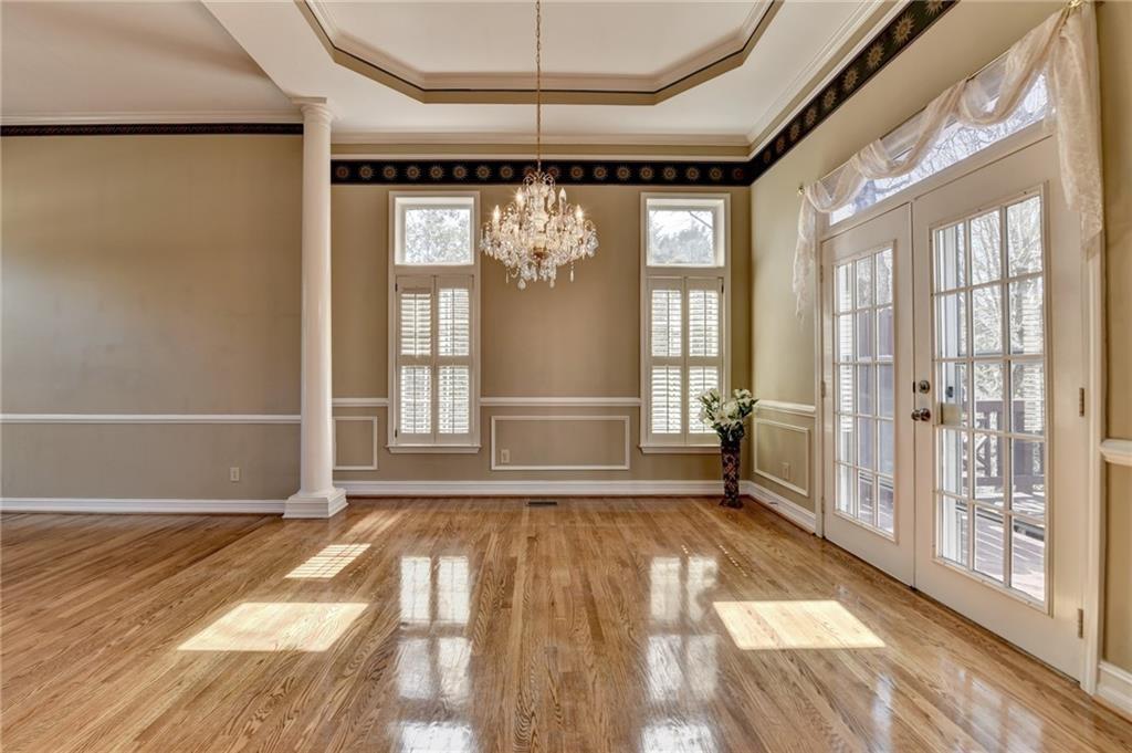 2382 Merrymount Drive Suwanee, GA 30024 - Photo 12 of 93 a view of empty room with wooden floor and fan
