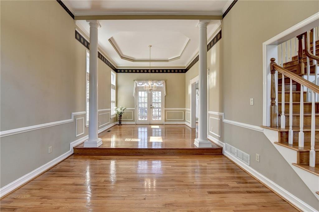 2382 Merrymount Drive Suwanee, GA 30024 - Photo 13 of 93 a view of entryway and hall with wooden floor