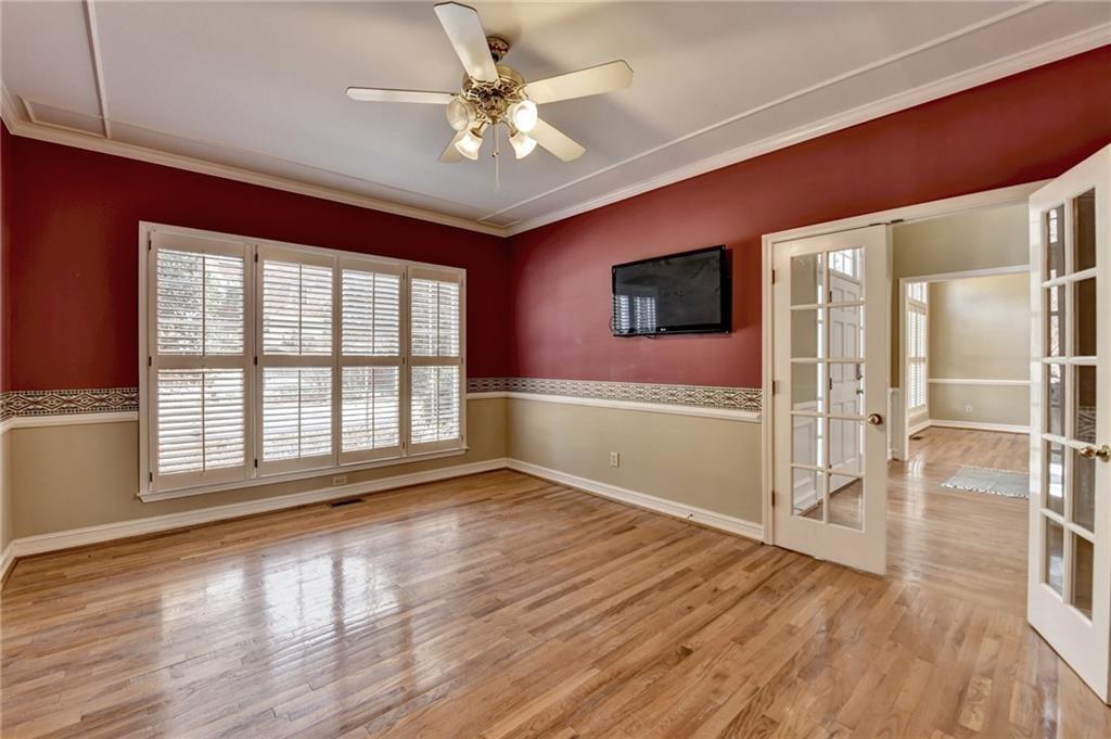 2382 Merrymount Drive Suwanee, GA 30024 - Photo 26 of 93 a view of an empty room with a window and wooden floor