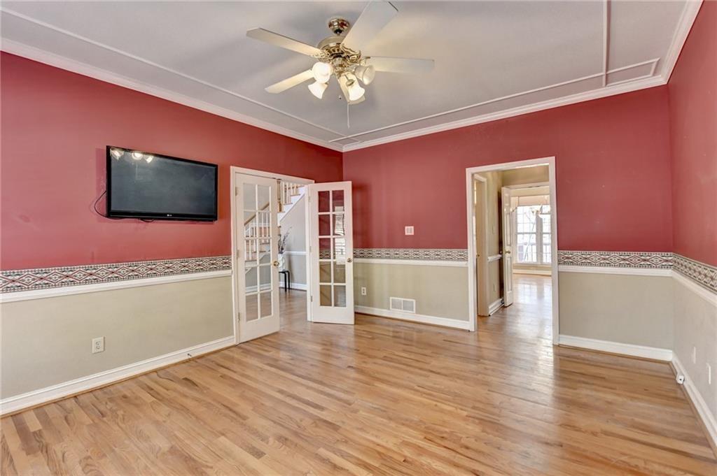 2382 Merrymount Drive Suwanee, GA 30024 - Photo 27 of 93 a view of livingroom with hardwood floor and ceiling fan