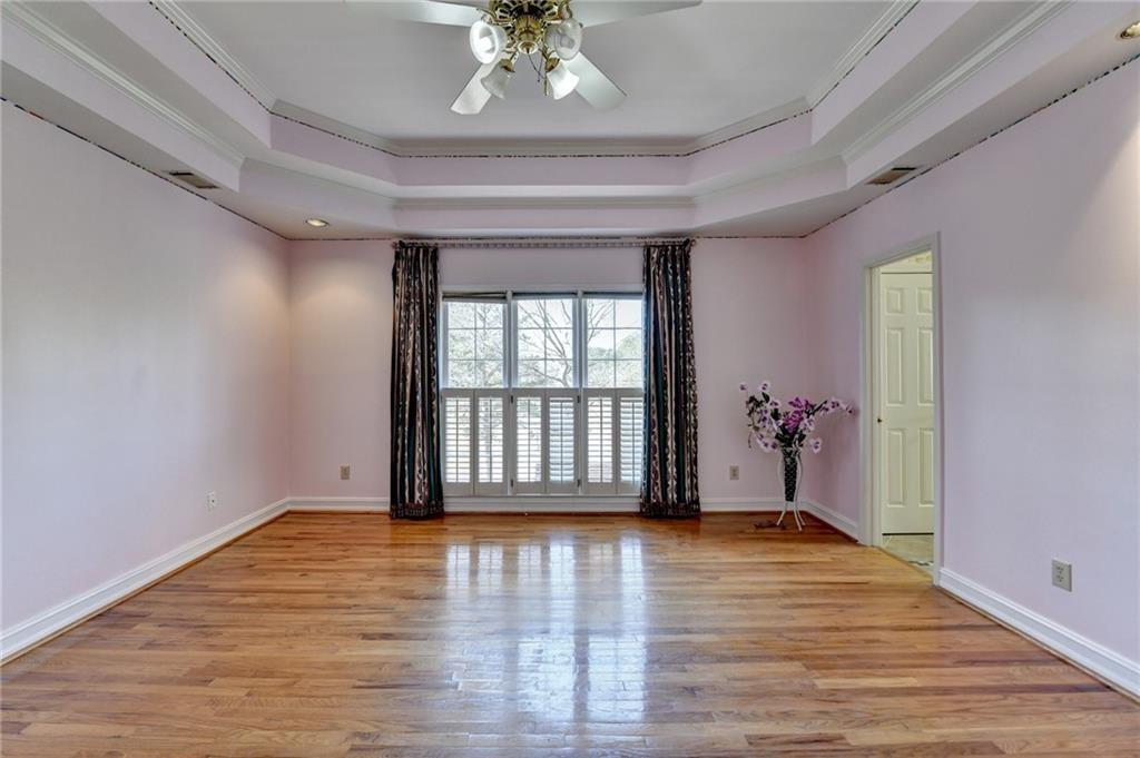 2382 Merrymount Drive Suwanee, GA 30024 - Photo 29 of 93 a view of an empty room with wooden floor and a window