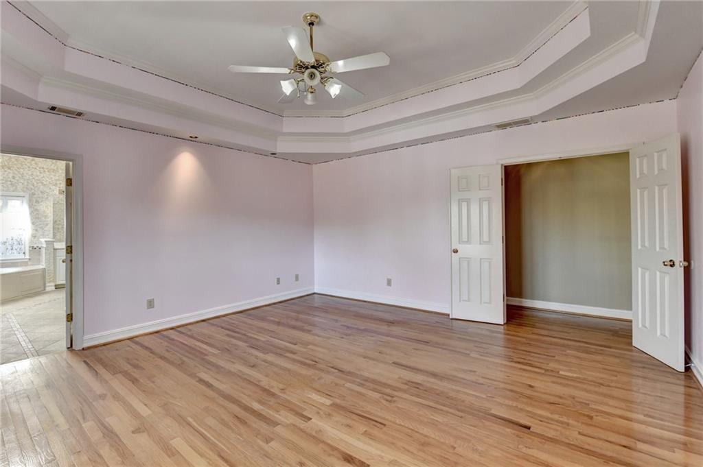 2382 Merrymount Drive Suwanee, GA 30024 - Photo 31 of 93 a view of an empty room with wooden floor