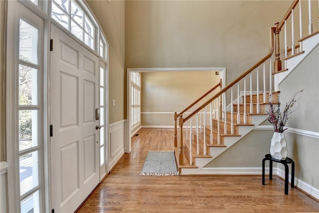 2382 Merrymount Drive Suwanee, GA 30024 - Photo 4 of 93 a view of entryway and hall with wooden floor