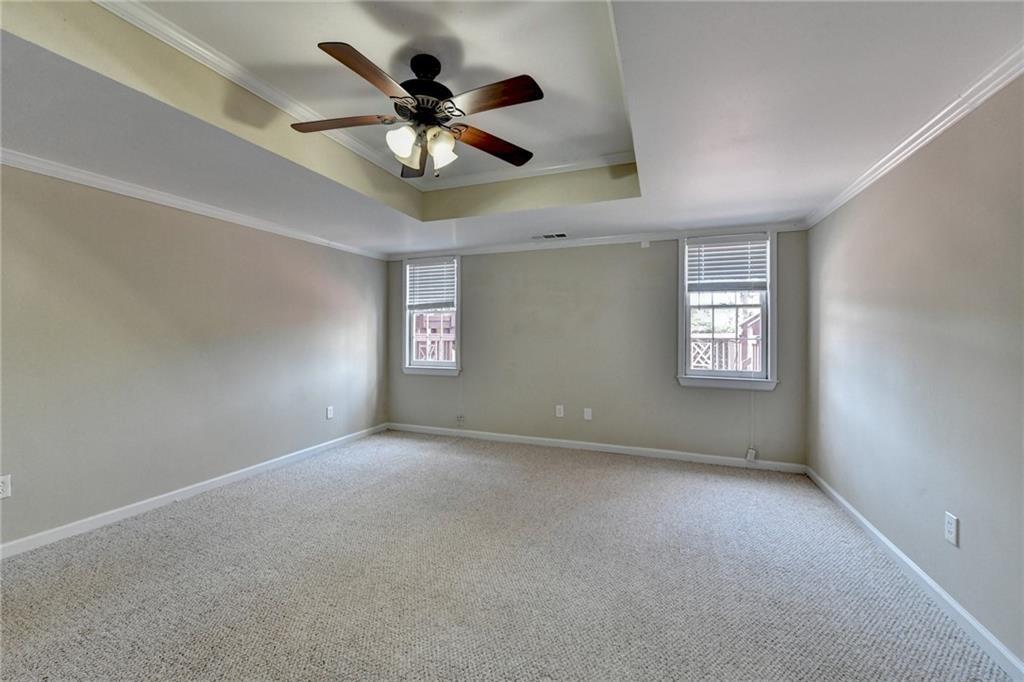 2382 Merrymount Drive Suwanee, GA 30024 - Photo 43 of 93 an empty room with windows and fan