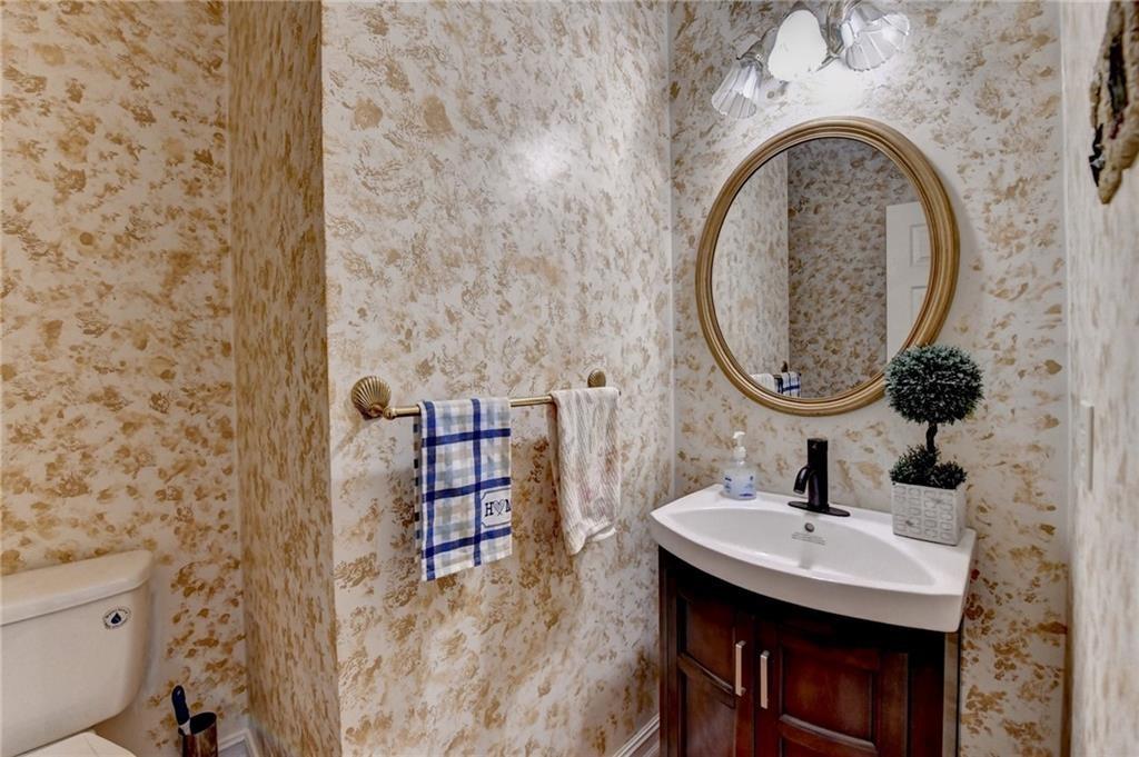 2382 Merrymount Drive Suwanee, GA 30024 - Photo 46 of 93 a bathroom with a sink and a mirror