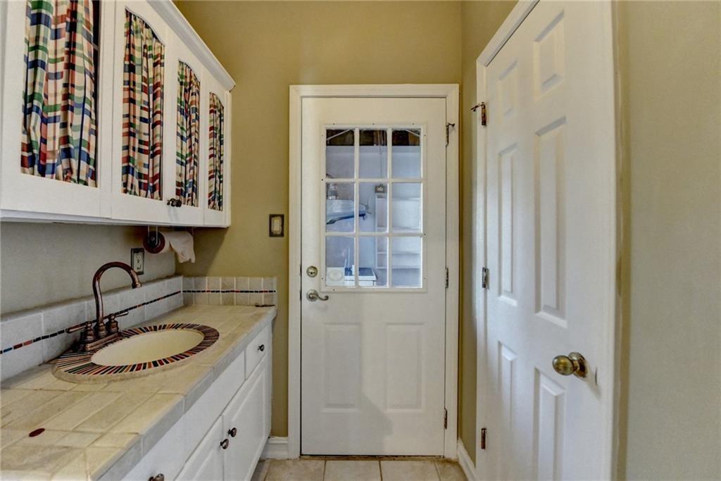 2382 Merrymount Drive Suwanee, GA 30024 - Photo 47 of 93 a bathroom with a sink and a mirror