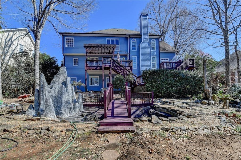 2382 Merrymount Drive Suwanee, GA 30024 - Photo 56 of 93 a view of a chairs and table in the backyard