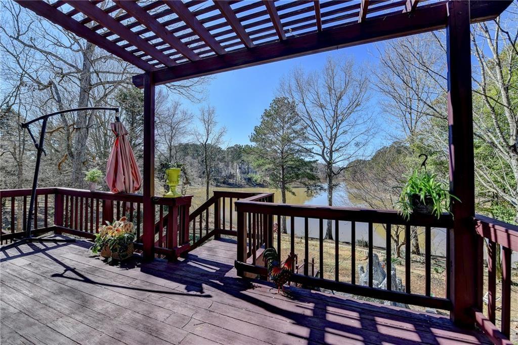 2382 Merrymount Drive Suwanee, GA 30024 - Photo 63 of 93 a view of balcony with wooden floor and outdoor seating