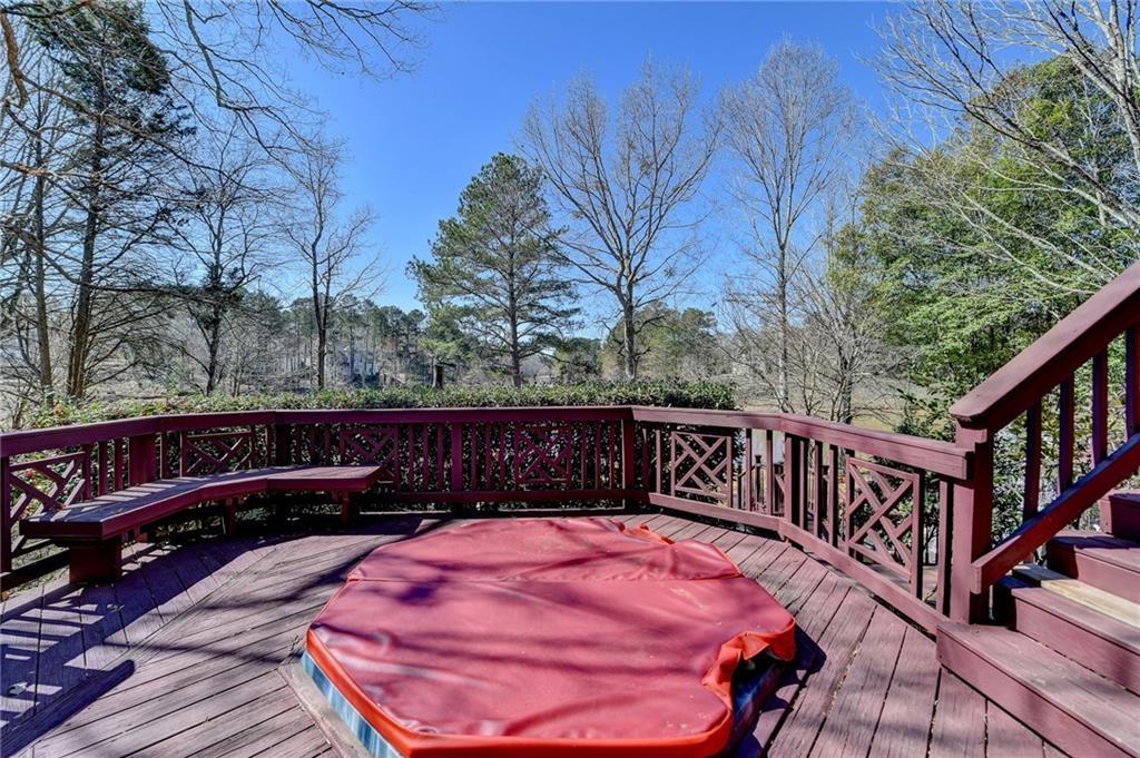 2382 Merrymount Drive Suwanee, GA 30024 - Photo 65 of 93 a view of balcony with wooden floor and outdoor seating