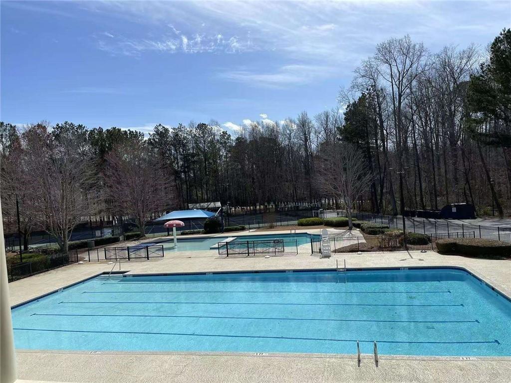 2382 Merrymount Drive Suwanee, GA 30024 - Photo 85 of 93 a view of swimming pool with outdoor seating and yard in the back