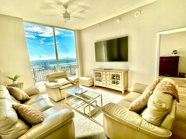 a living room with furniture and a flat screen tv
