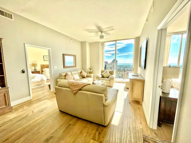 a living room with furniture and a large window