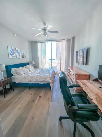 a bedroom with a bed and a chair