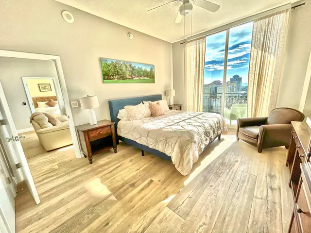 a bedroom with a bed and wooden floor