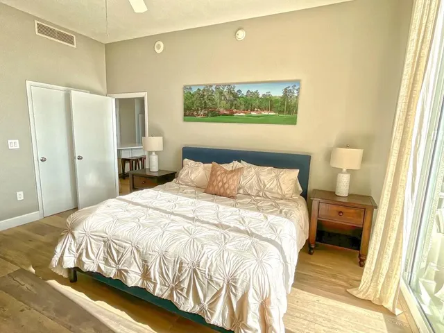 a bedroom with a bed and a mirror