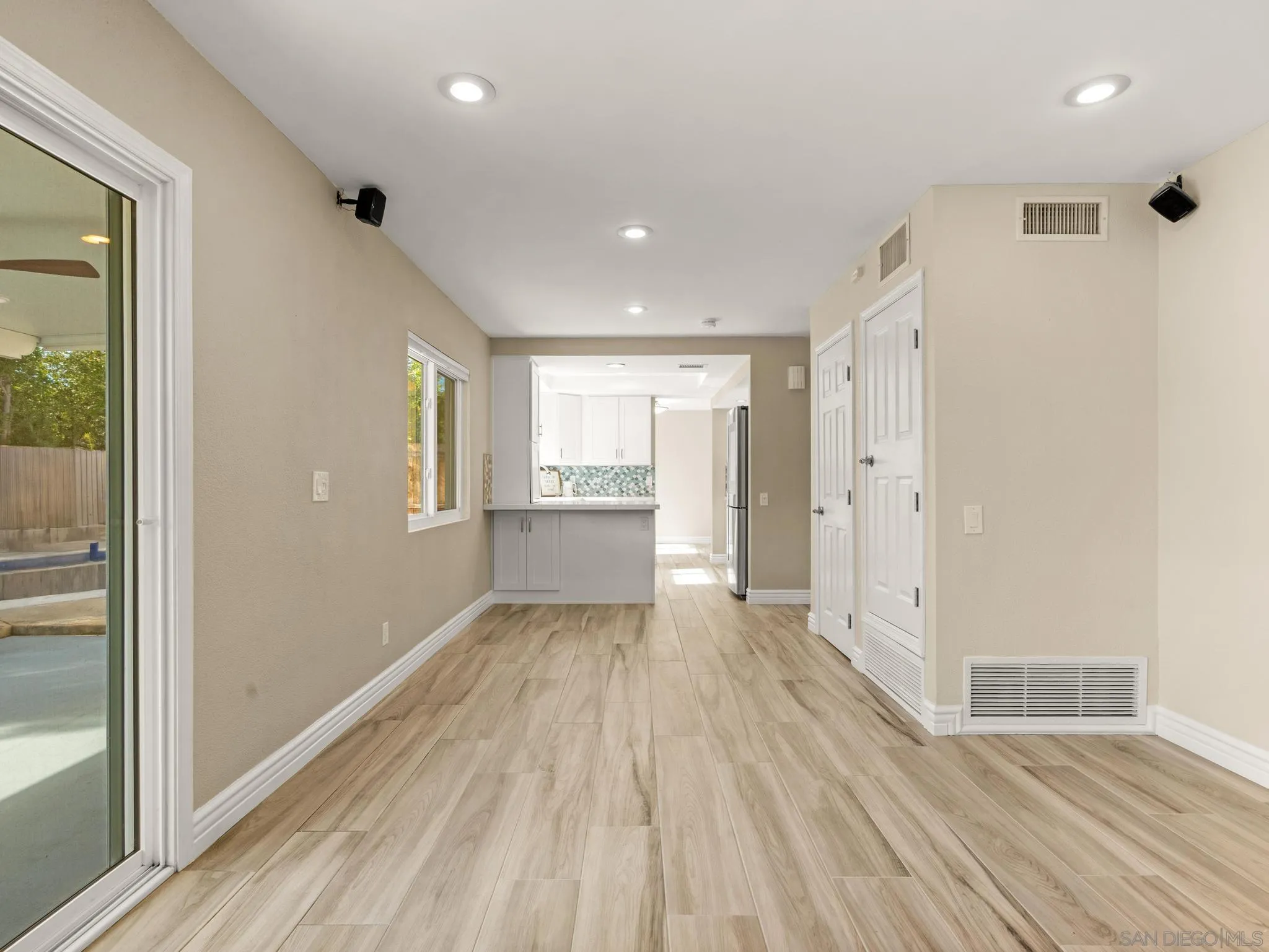 13303 Betty Lee Way Poway, CA 92064 - Photo 13 of 32 a view of an empty room with wooden floor and a window
