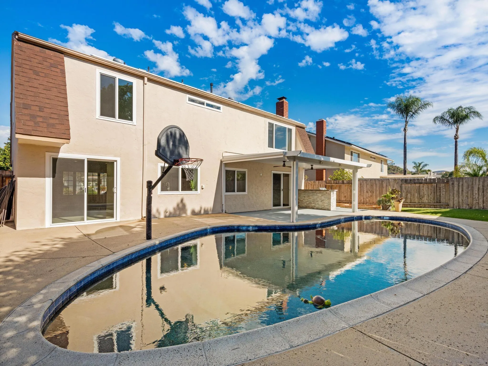 13303 Betty Lee Way Poway, CA 92064 - Photo 17 of 32 a view of a house with pool and a yard