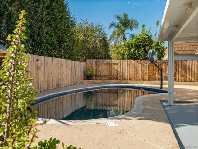 a view of balcony with wooden fence
