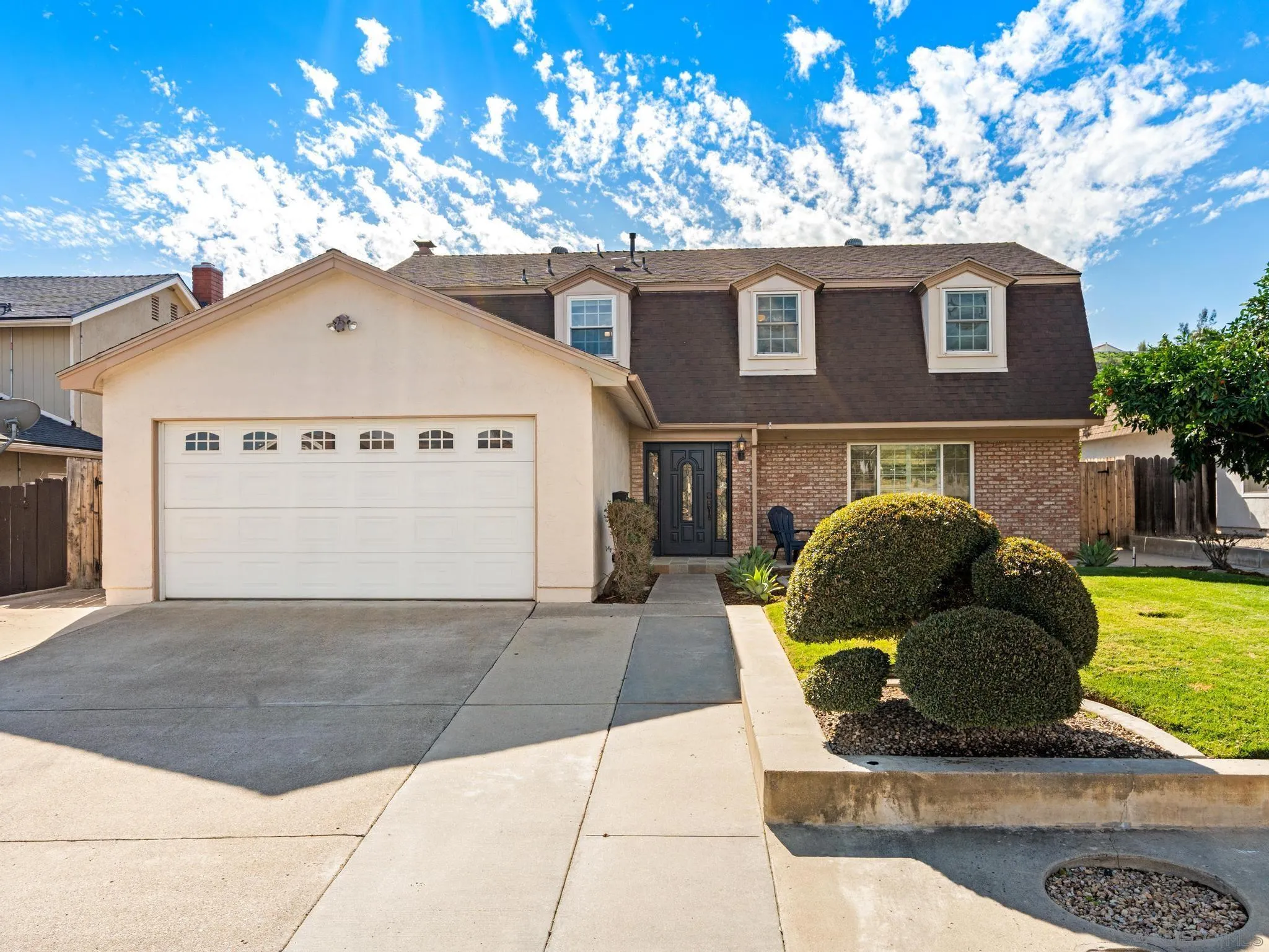 13303 Betty Lee Way Poway, CA 92064 - Photo 2 of 32 a front view of a house with garden