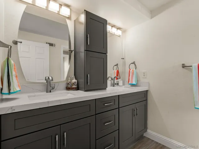 a bathroom with a bathtub and shower