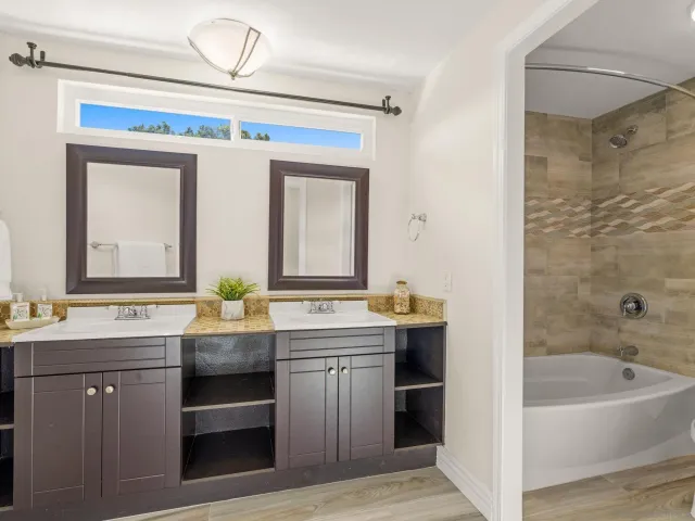 a bathroom with a bathtub and a shower
