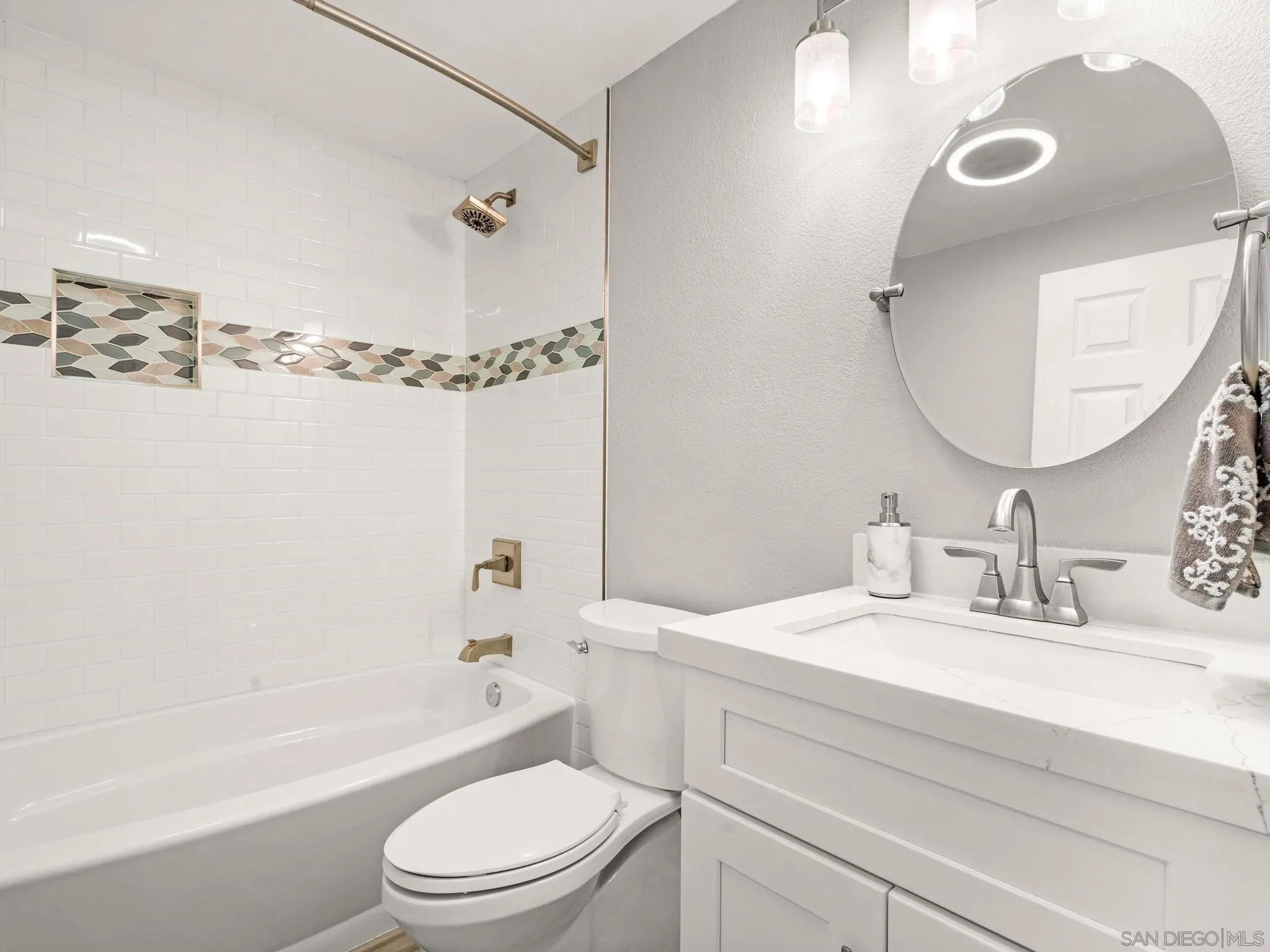 13303 Betty Lee Way Poway, CA 92064 - Photo 30 of 32 a bathroom with a sink a toilet and a mirror