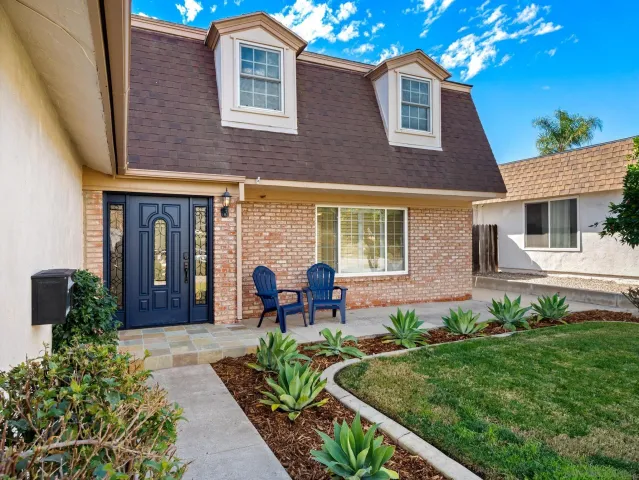 a front view of a house with garden