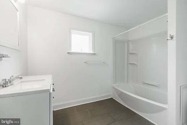 a bathroom with a bathtub sink and toilet