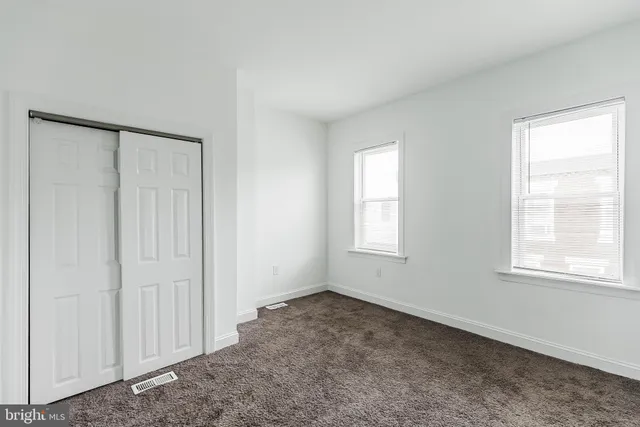 an empty room with windows