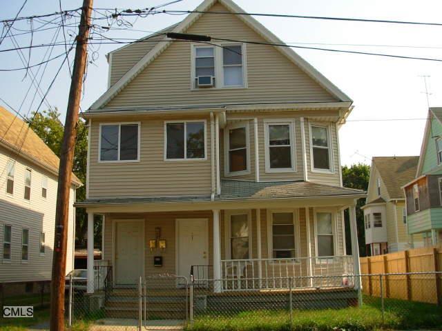 164 Kelsey Street Bridgeport, CT 06607 - Photo 1 of 1 a view of a brick house with many windows