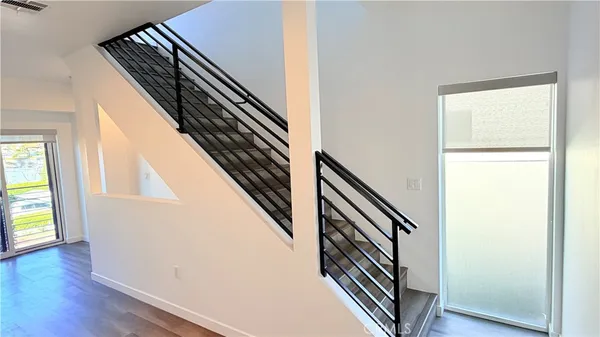 an entryway with wooden floor
