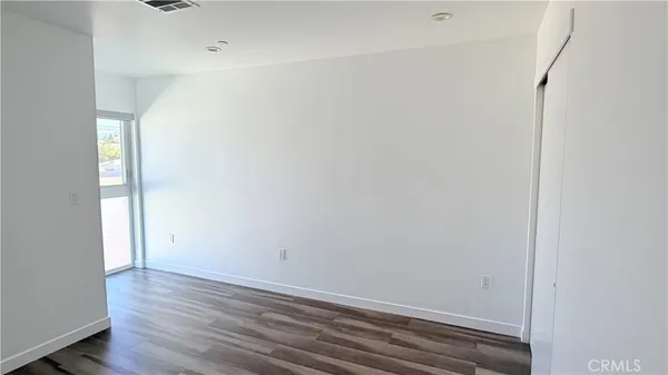 a view of small space with wooden floor