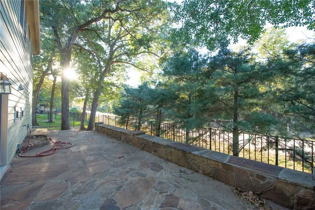 a view of a yard with potted plants