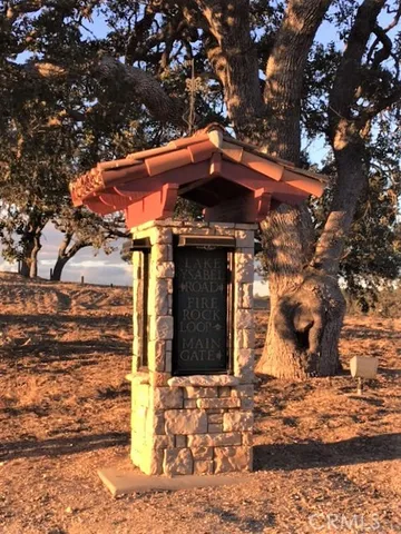 a view of a house with a tree