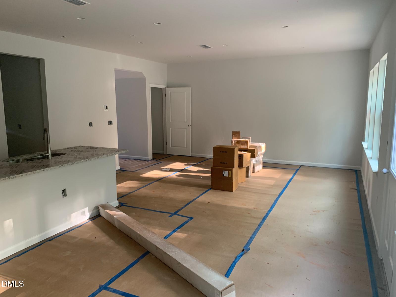 233 Broomside Avenue Raleigh, NC 27603 - Photo 7 of 18 a view of a livingroom with a staircase