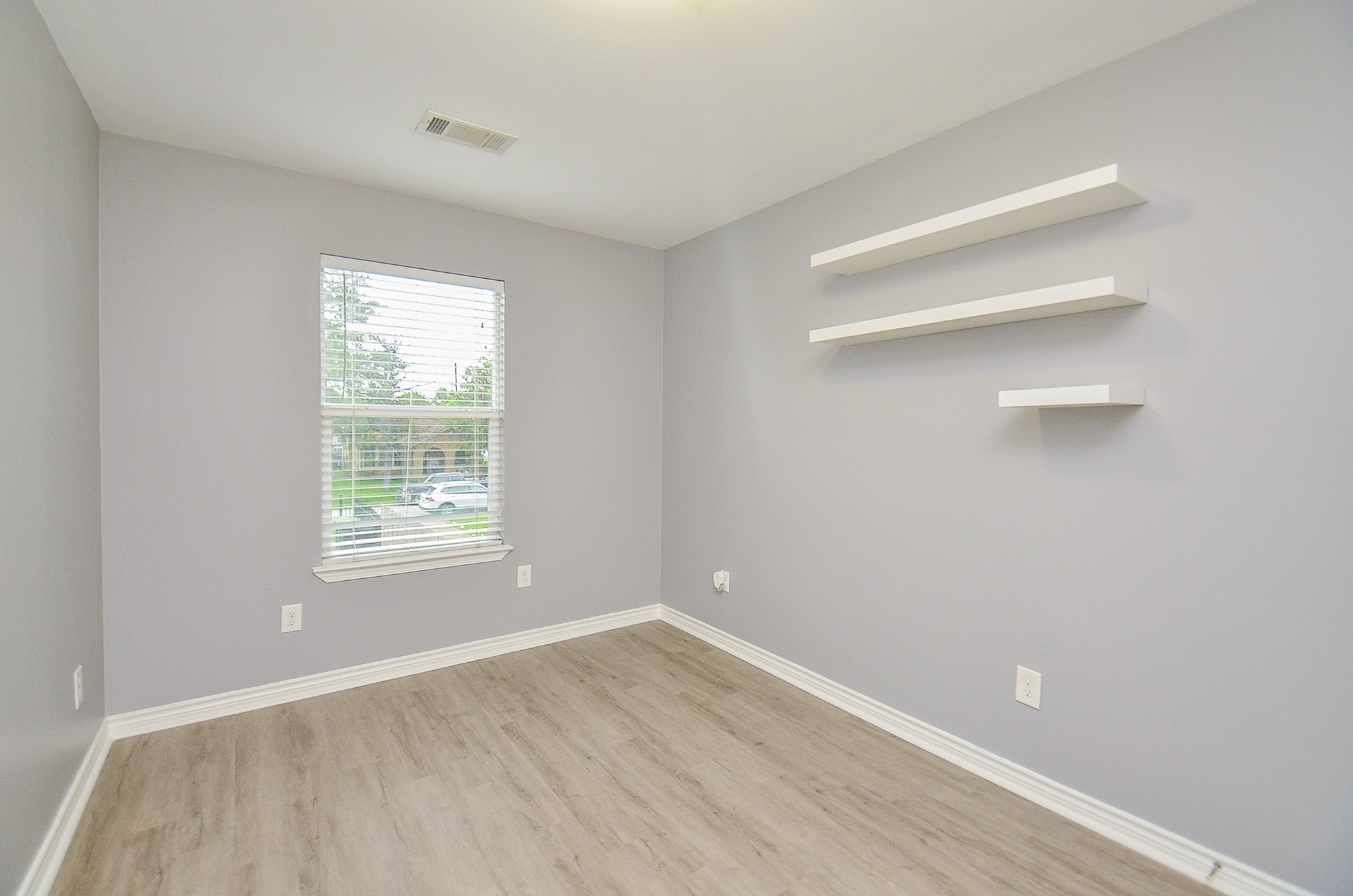 303 Vincent Street, Unit A Houston, TX 77009 - Photo 11 of 15 Bedroom with window facing driveway