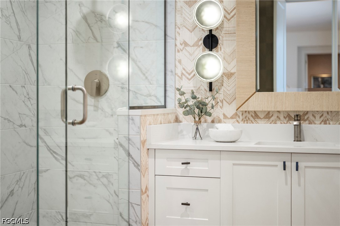 1115 Central Avenue, Unit 443 Naples, FL 34102 - Photo 17 of 40 a bathroom with mirror