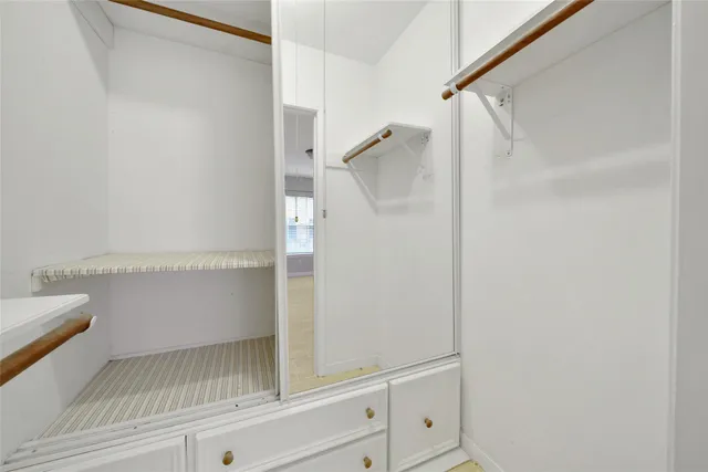 a bathroom with a sink a mirror and shower
