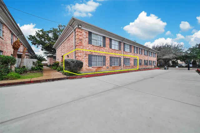 a row of palm trees in front of a house