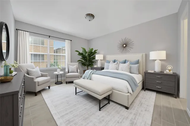 a spacious bedroom with a bed and a couch