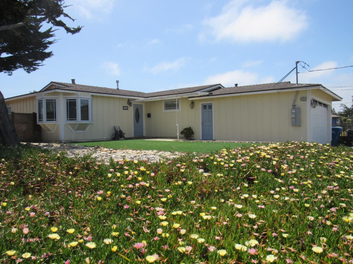 3038 King Circle Marina, CA 93933 - Photo 1 of 21 a front view of a house with a garden