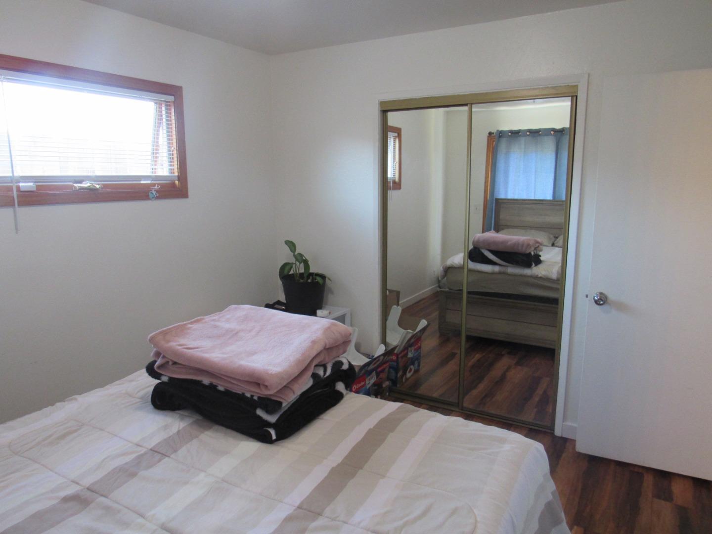 3038 King Circle Marina, CA 93933 - Photo 12 of 21 a bedroom with a bed and a window