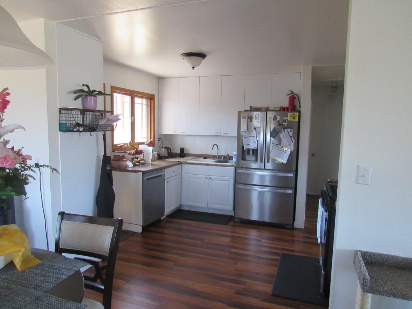 3038 King Circle Marina, CA 93933 - Photo 9 of 21 a kitchen with a sink cabinets and stainless steel appliances