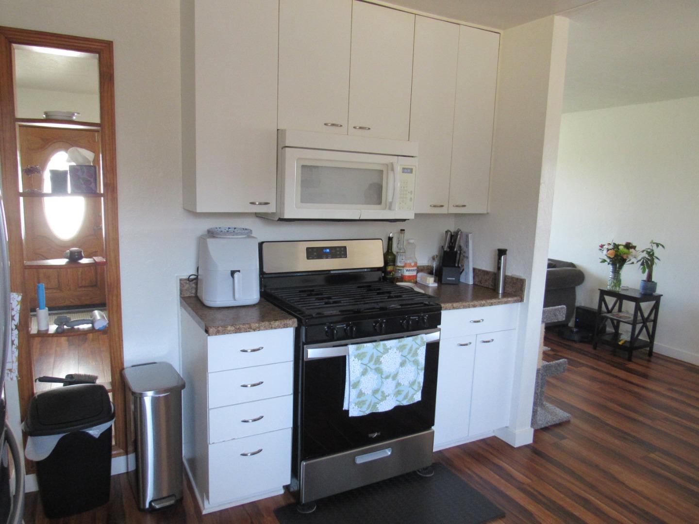 3038 King Circle Marina, CA 93933 - Photo 10 of 21 a kitchen with stainless steel appliances granite countertop a stove a sink and a white cabinets