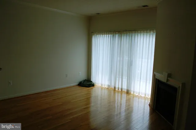 a view of wooden floor and staircase in a room
