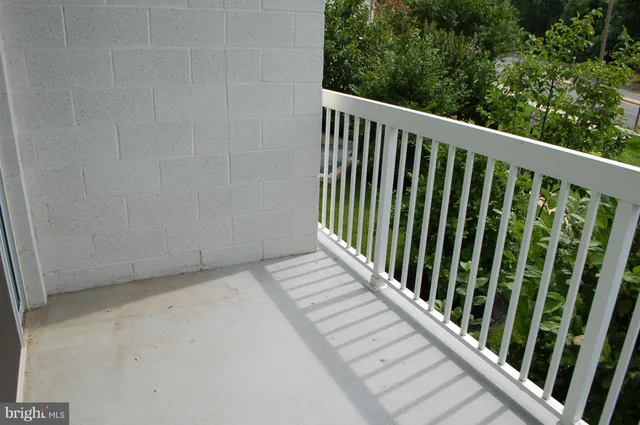 a view of a balcony with wooden floor